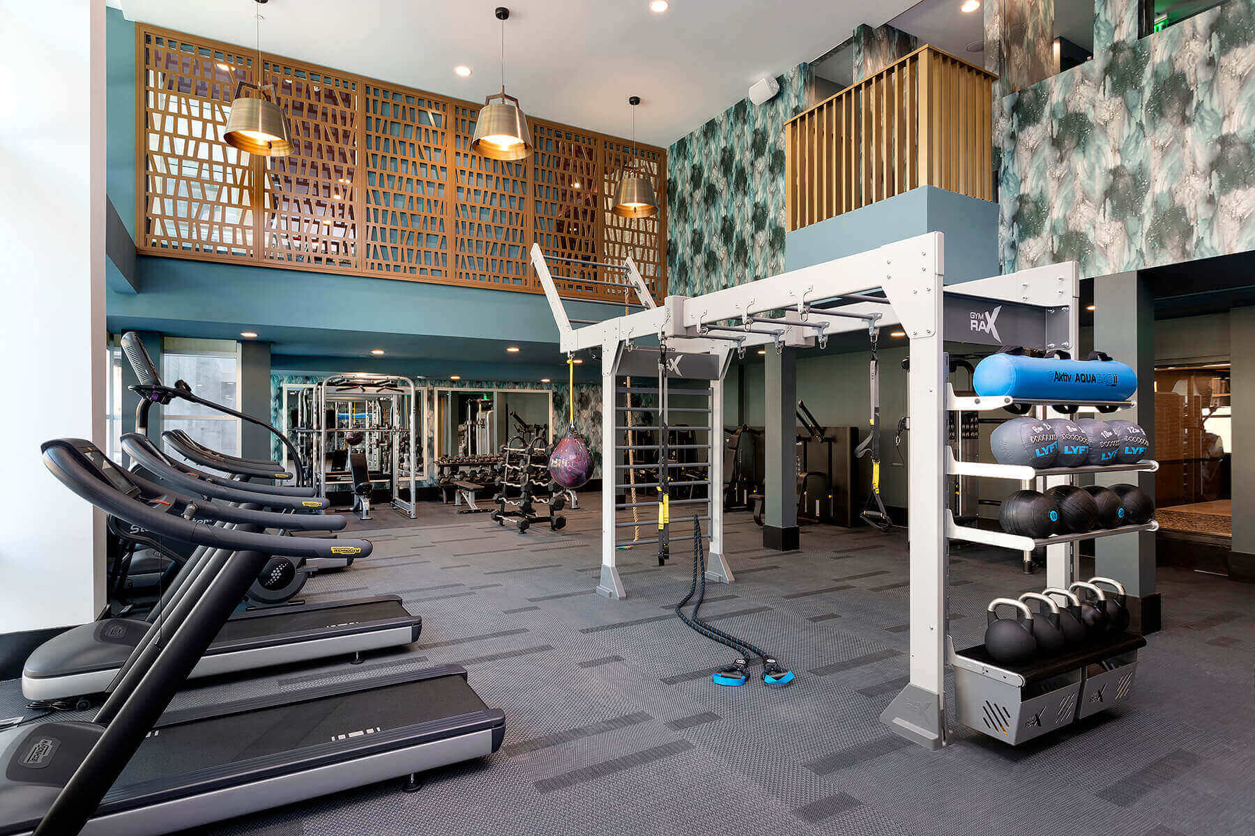fitness center with treadmills weight and trx straps at broadstone arden