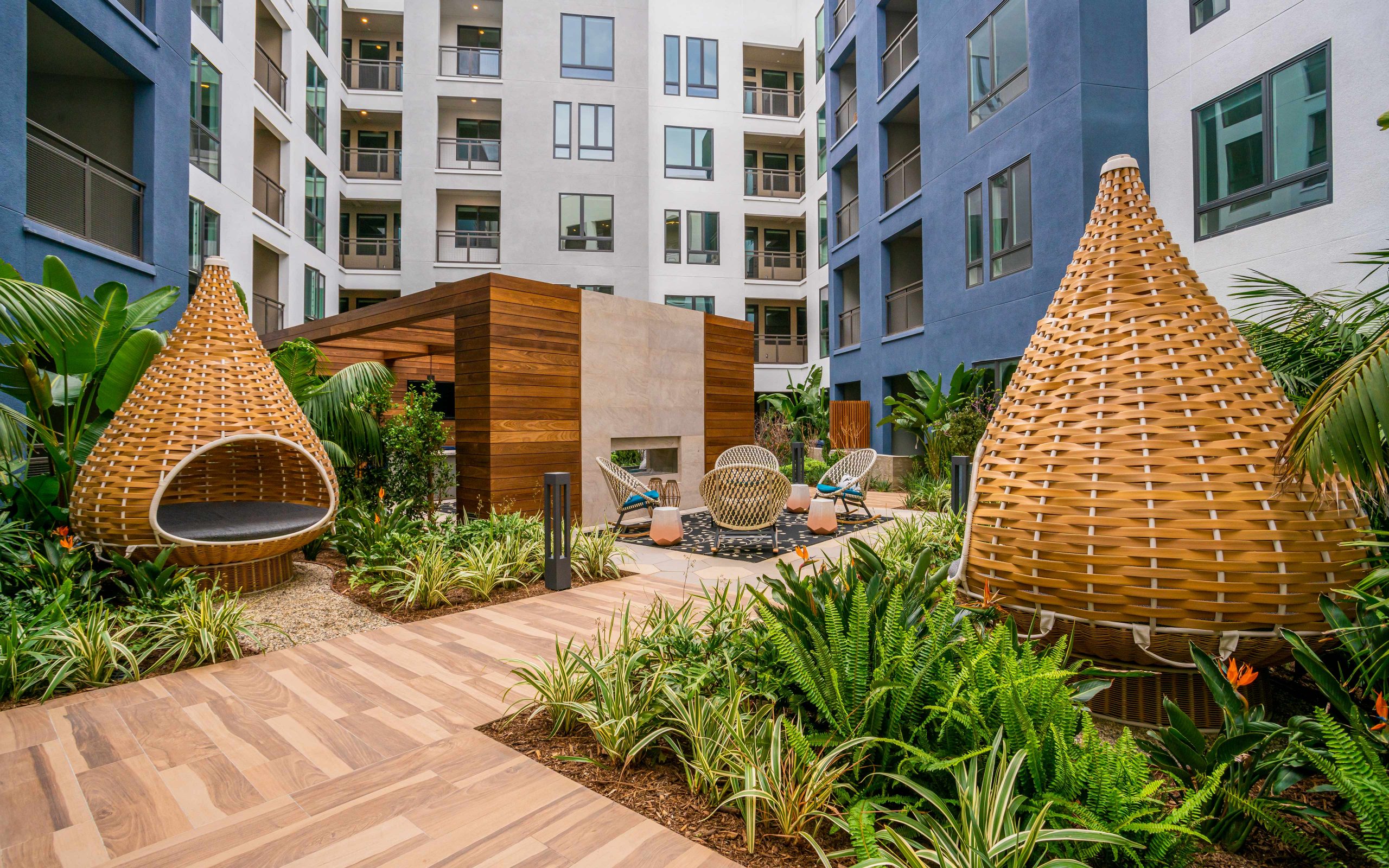 semi private cabana nests and outdoor fireplace in courtyard at broadstone arden apartments